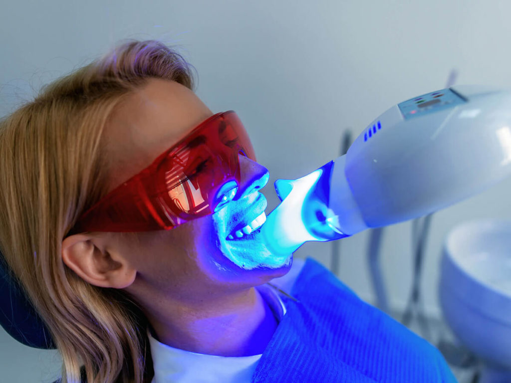 woman receiving teeth whitening