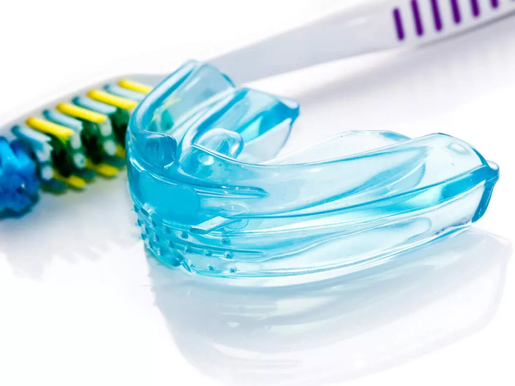 mouth guard and a toothbrush