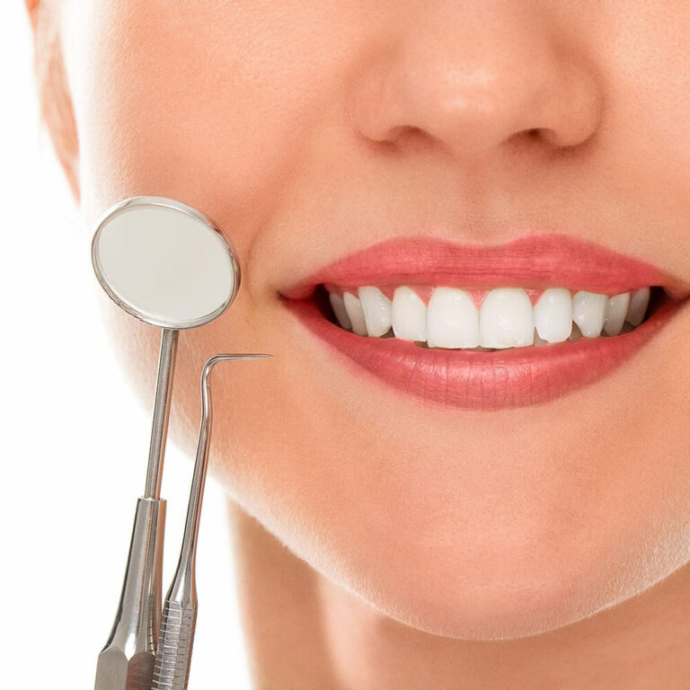 smiling woman with dental tools